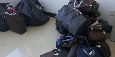 烟台查获百余件LV商标侵权商品 多为女士手包和